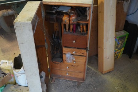 Cabinet containing various planers, chisels, etc.