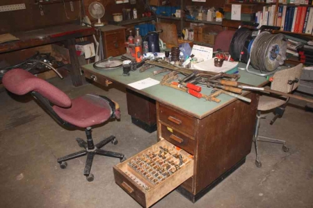 Work Bench with content: Various cutting tools, drills, etc.