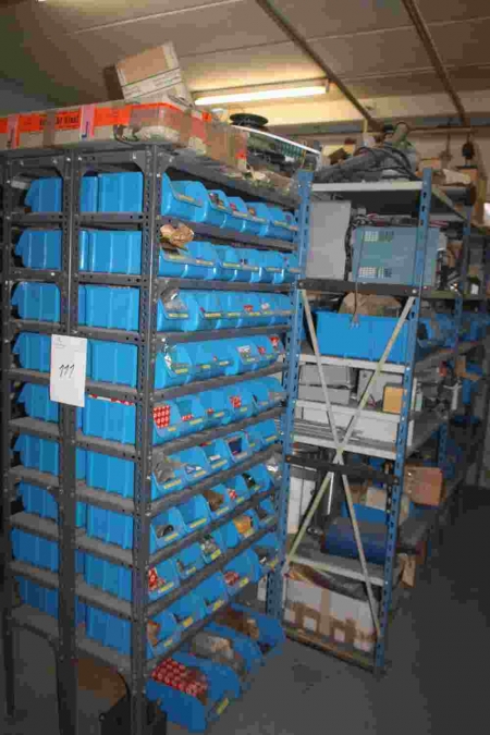 8 section steel rack containing various pneumatic cylinders, bearings, etc.