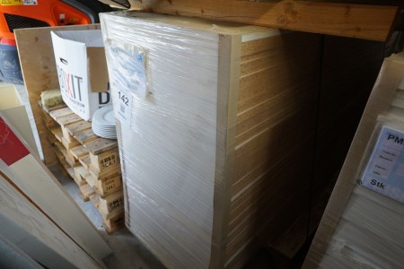 Pallet with various wooden elements for the production of cabinets, drawers, etc.