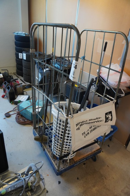 Iron cage on wheels containing various lances for vacuum cleaners