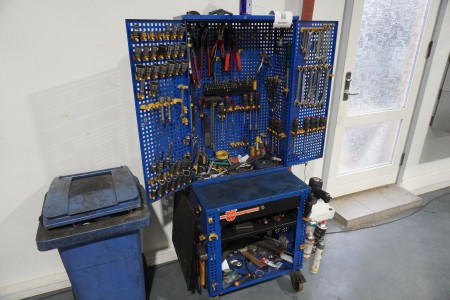 Tool cabinet containing various hand tools