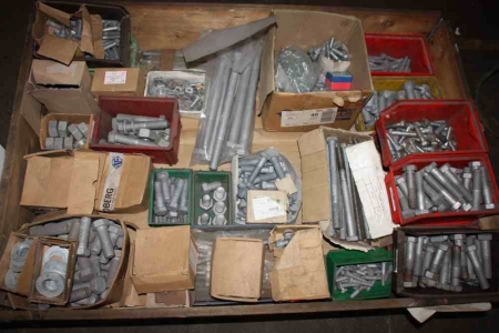 Pallet with various galvanized bolts, nuts and disks