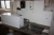 Steel table with sink, water heater (Metro) and dispenses paper towel, soap and creams