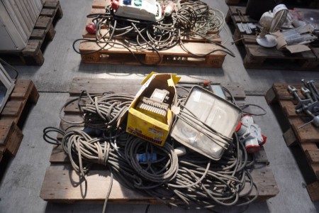 Pallet with various cables, power distributors, work lamps, etc.