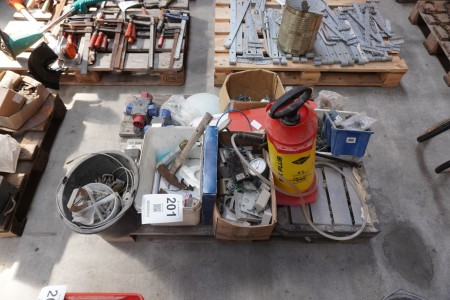 Pallet with various contacts, nails, screws, sprayer, etc.