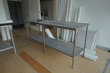 Kitchen table in steel with faucet
