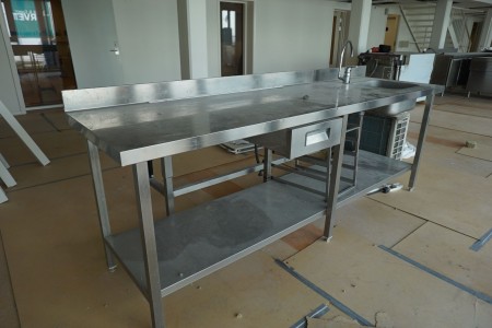 Kitchen table in steel with faucet