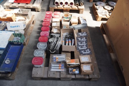 Pallet with various screws, fittings, locks for the winner, gas for the nail gun, etc.