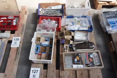 Pallet with miscellaneous, screws, nails, accessories for doors, etc.