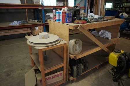 Wooden workshop table with contents