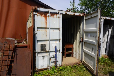 20 foot container containing contents of file bench, wheelbarrows, cupboards, etc.