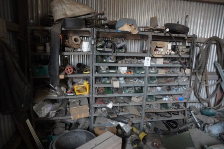 3 steel shelves containing various spare parts