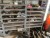3 steel shelves with content of various spare parts etc.
