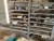 3 steel shelves with content of various spare parts etc.