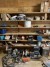  Bookcase containing various motors, tool boxes, sealing strips, PTO, vices, etc.