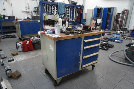Wooden workshop rolling table with contents