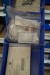 Contents on 2 shelves of various spare parts for Alfa Romeo/Fiat