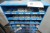 2 pcs. assortment shelves containing various screws, bolts, tensioning straps, etc.