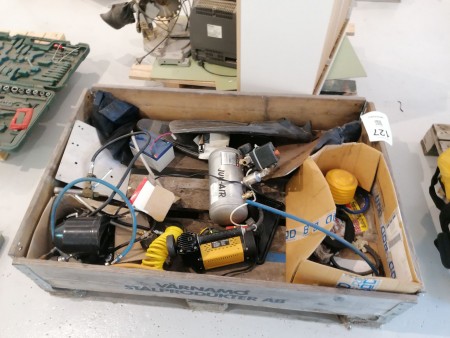 Pallet with various compressors, batteries, fins, etc.