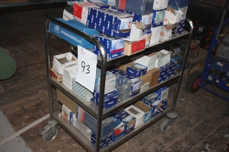 Stainless steel trolley containing nails, screws, etc.