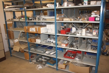 Content in and on 3 section steel shelving (plumbing fittings, etc.)