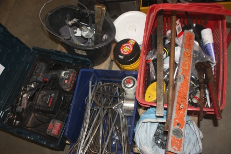 Pallet with various tools, including cordless drill, Bosch battery and charger