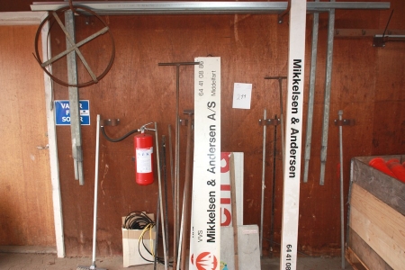 Miscellaneous metal racks on the wall, tools, signs, fire extinguisher on the wall, etc.