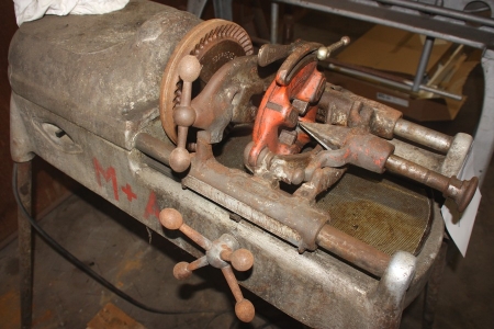 Threading machine, Ridgid 535, on tripod + various thread-cutting tools