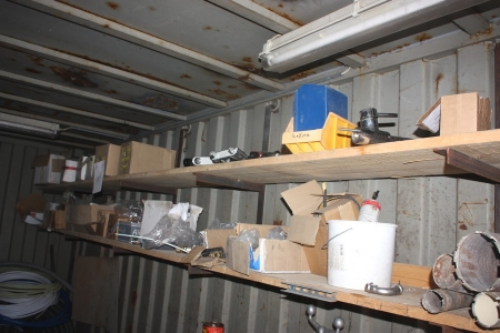 Contents of 2 shelves: Various plumbing fittings, drill stand for diamond drill + approx. 9 cores