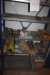 1 section steel rack with content: welding electrodes, etc.