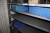 4 compartment storage rack containing various spare parts