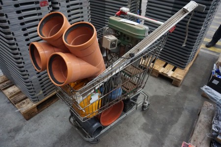 Shopping cart incl. various PVC pipes, gas bottles etc.