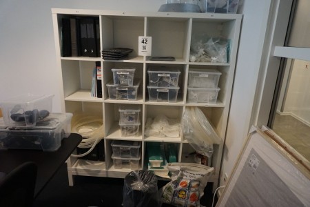 Bookcase containing various laboratory equipment