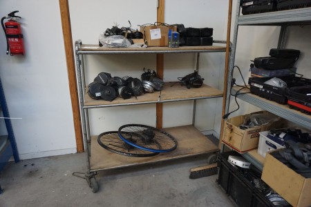 Trolley containing various spare parts for electric bicycles