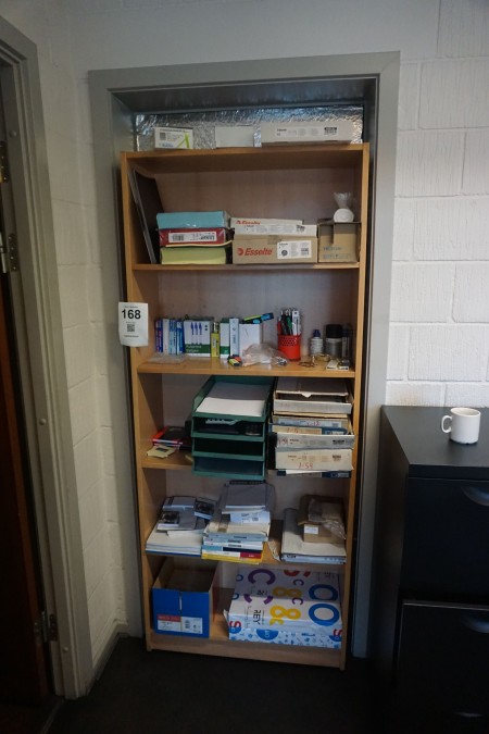 Bookcase containing various office supplies