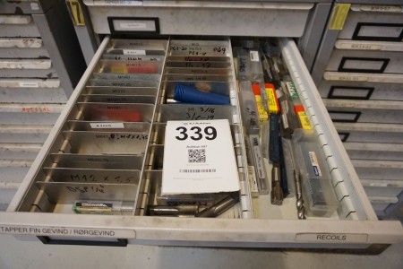 Drawer with various machine stages, finger threads, etc.
