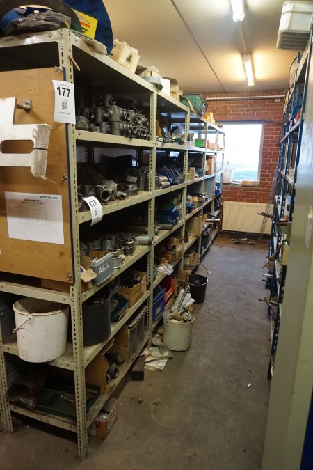 Contents of 5-bay shelf of various pipe fittings, couplings, etc.