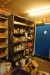 2-bay bookcase containing various chemicals, spray paint, oil, etc.
